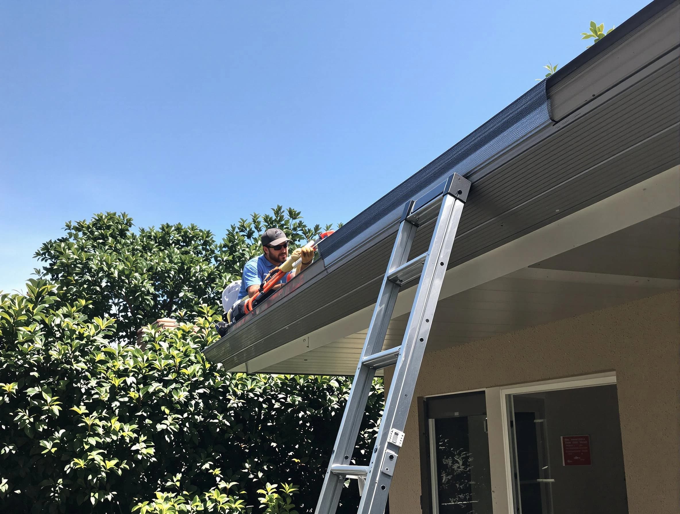 Twinsburg Roofing Company installing gutter guards for a homeowner in Twinsburg, OH